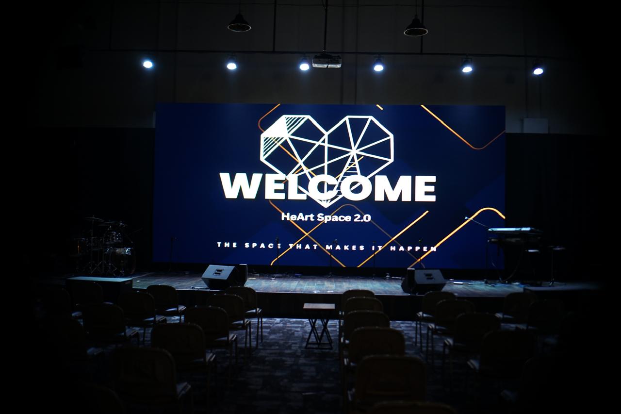Heart Space 2.0 main stage with a large LED welcome screen